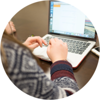 A student types on a laptop